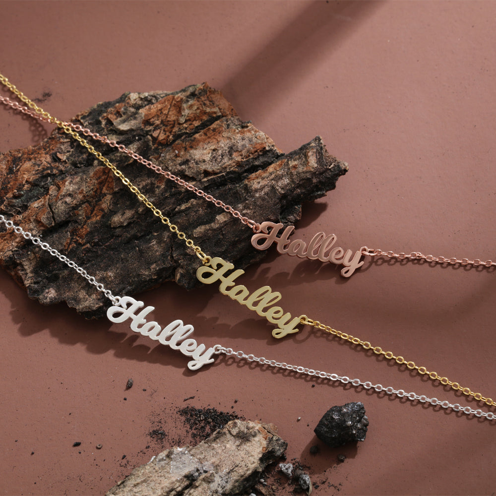 Yellow Gold White Gold and Rose Gold Plated Silver Cursive Script Necklace Displayed